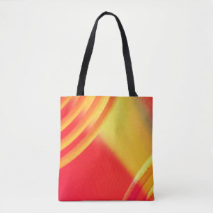 Gelb- und orangefarbenes Rundmuster auf einer Tasc