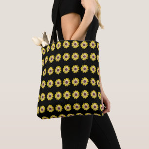 Gelbe afrikanische Daisy-Blumenmuster auf Schwarz