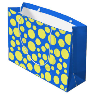 Gelbe Erbsen auf himmelblauem Hintergrund Große Geschenktüte
