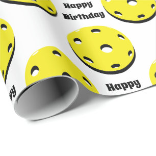 Gelbe Picklebälle überall auf dem Geschenkpapier