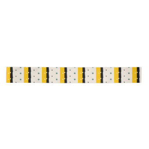 Gelbe schwarze Geschenkpapier Satinband