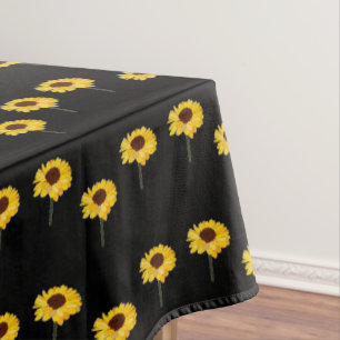 Gelbe Sonnenblumen auf schwarz Tischdecke