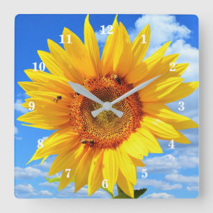 Gelbe Sonnenblumen und Bienen auf blauem Himmel -  Quadratische Wanduhr