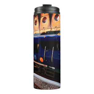 Gelbe und blaue Bahn am Bahnhof York Thermosbecher