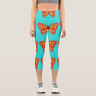 Gelbe und orangefarbene Schmetterlinge Capri Leggings