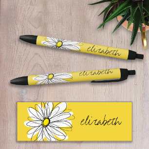Gelbe und weiße weiße, weißliche Daisy mit benutze Kugelschreiber