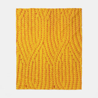 Gelber gestrickter Untergrund aus Spinnstoffen Fleecedecke