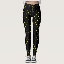 Gelber Tupfen auf schwarzen Leggings