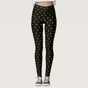 Gelber Tupfen auf schwarzen Leggings