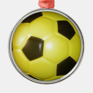 Gelber und schwarzer Fußball. Ornament Aus Metall