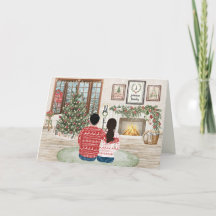 Gemütliches Paar am Kamin Familienweihnachten