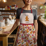 Gemütliches Weihnachtsgingerbrot Mann Grammie's Ki Schürze<br><div class="desc">Dieses festliche Design entstand mit meinen süß-skandinavischen inspirierten Keksen, die wie ein Lebkuchenmensch geformt wurden, einem Weihnachtsbaum und einem Stern, umgeben von Zitrusfrüchten, getrockneten Gewürzen, Pflanzen und Beeren, die das Gefühl einer warmen Hütte-Küche in Oma mit den Düften des Urlaubbuches wecken! Der Boden ist ein klassischer handgezeichneter Gingham in einem...</div>