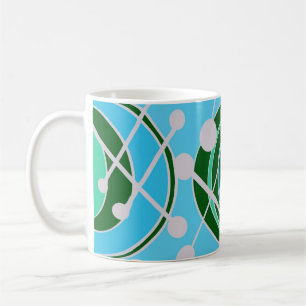 Geoformen in grün und blau mit weißer Tasse