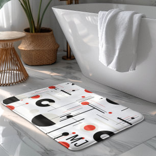 Geometrische, rote, schwarze Bauhaus-Formen auf we Badematte