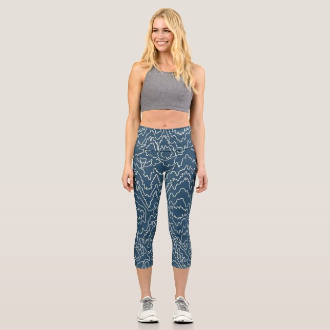 Geometrische weiße Curvy-Linien auf blau Capri Leggings (Vorderseite)
