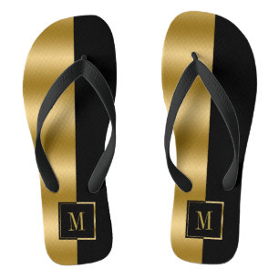 Geometrisches Monogramm aus Gold und schwarzem Str Flip Flops