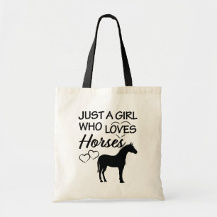 Gerade ein Mädchen das lustiges Geschenk der Tragetasche