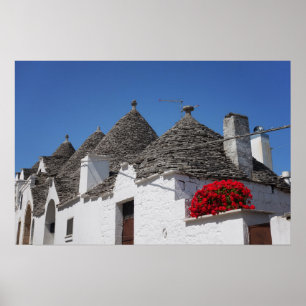 Geranium Blume und Trulli Häuser in Alberobello Poster