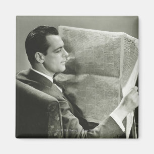 Geschäftsmann, der die Zeitung liest Magnet