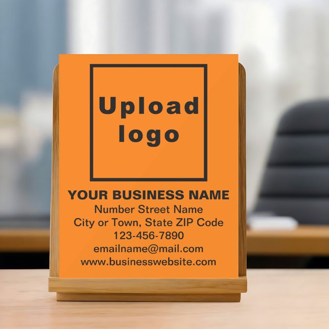 Geschäftsmarke auf orangem Acrylschild (Orange acrylic sign with your business brand)