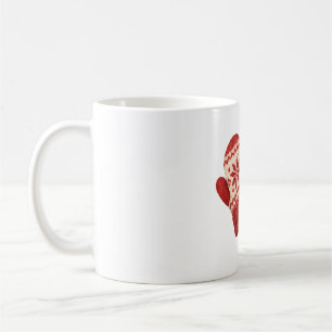 Gestrickte Handschuhe und Kiefernzapfen Kaffeetasse
