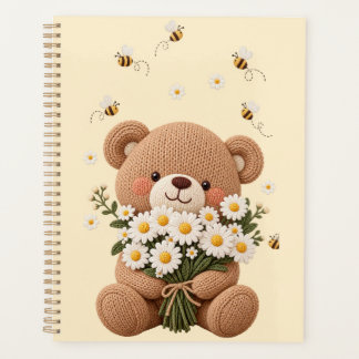 Gestrickter Teddybär mit Gänseblümchenstrauß und s Planer
