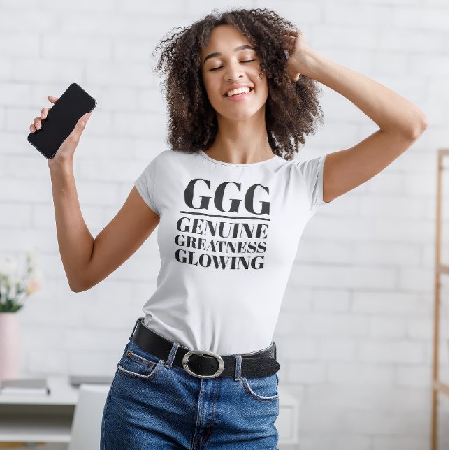 GG - Echt, Größe, Glühen T-Shirt (Young woman dances in "GGG: Genuine, Greatness, Glowing" white t-shirt.)