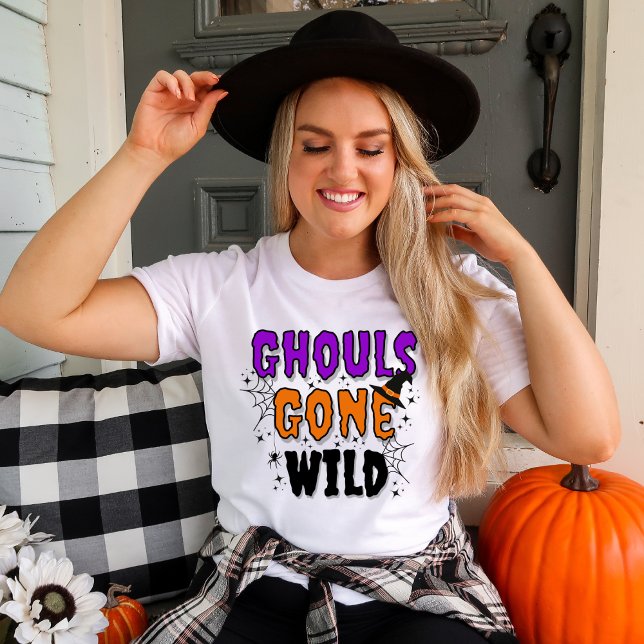 Ghouls Gone Wild Modern Halloween T - Shirt (Women in a white t-shirt with Ghouls Gone Wild Halloween topography with fall decor.)