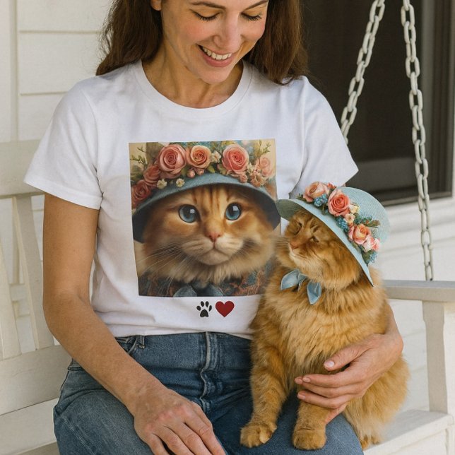 Ginger Cat in Blue Hat mit Blume Cat Lover T-Shirt ( a warm, spring‑fresh porch moment with the lady on her swing, petting her cat . Pet lovers  t-shirt)