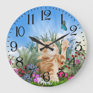 Ginger kitten playing with a butterfly große wanduhr