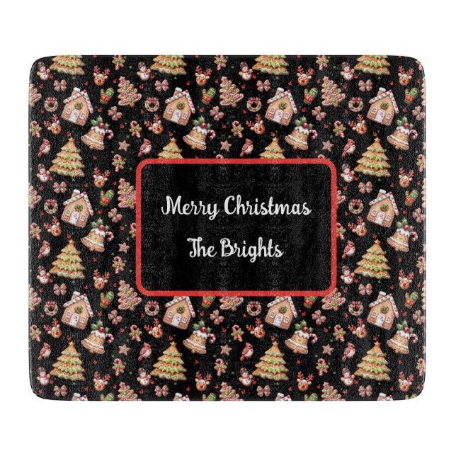 Gingerbrot Weihnachtskochtchen auf schwarzem Hinte Schneidebrett (Vorderseite)