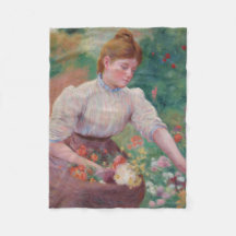 Girl Picking Blume im Sommergarten