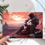 Gitarrist der Astronauten spielt Gitarre - Geburts Karte<br><div class="desc">Es war der Geburtstag, und der Astronaut hatte beschlossen, etwas Besonderes zu tun. Er war zu vielen Planeten gewesen während seiner Zeit im All, aber er war noch nie auf diesem gewesen. Dieser Planet war anders als jeder andere, den er zuvor gesehen hatte, mit einer Oberfläche, die ein tiefes, brennendes...</div>