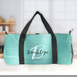 Glam Aqua Brushed Metal Schwarz-weiß Monogram Duffle Bag<br><div class="desc">Diese personalisierte Duffeltasche hat ein Monogramm und Vorname in modernem Schwarz-Weiß-Drehbuch auf einem glam aqua Imitate gebürstet Metall Hintergrund.</div>