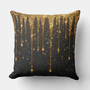 Glänzende Gold-Glittertropfen über dunklem Hinterg Kissen