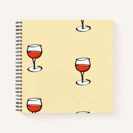 Glas Wein auf Orange Notizbuch