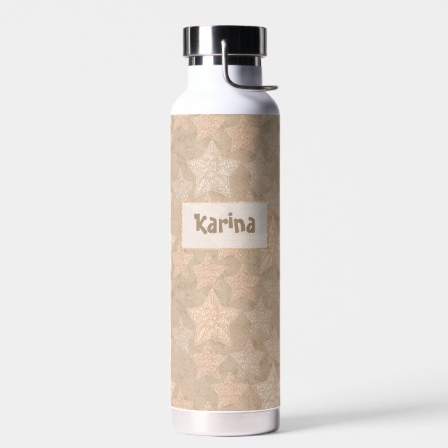 Glitzer sternt auf beige Handarbeit. Trinkflasche (Links)