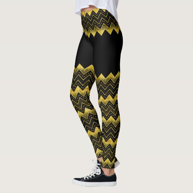 Glitzer von Zickzack Imitaten aus Schwarz und Gold Leggings (Links)