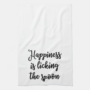 Glück leckt das Löffel Tuch