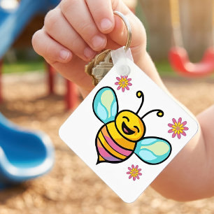 Glückliche lächelnde Kawaii-Babybiene mit süßen Bl Schlüsselanhänger
