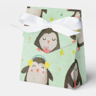 Glückliche Pinguine mit Weihnachtsmannmützen und O Geschenkschachtel