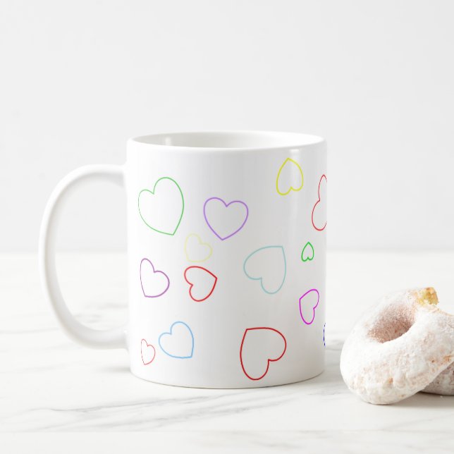 Glückliche spielerische und farbenfrohe Herz-Tasse Kaffeetasse (Mit Donut)