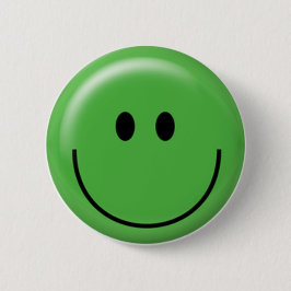 Glückliches grünes Gesicht Button