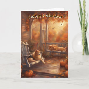Glückliches Halloween-Katze und Hund auf einer Vor Karte