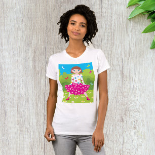 Glückliches kleines Mädchen mit Blumen und Schmett T-Shirt