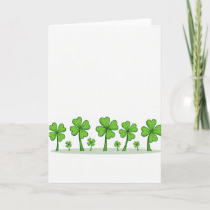 Glückskarte mit grünen Shamrocks Karte