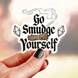 Go Smudge Sie selbst Funny Vinyl Aufkleber<br><div class="desc">Dieser lustige Aufkleber enthält den Satz "Go Smudge Yourself" mit Mudge Sticks und Kristallen. Ideal für diejenigen,  die spirituelle Reinigung und Spaß Liebe haben. Dieser haltbare Vinyl Aufkleber eignet sich hervorragend für Laptops,  Wasserflaschen und vieles mehr. Zeigen Sie mit diesem einzigartigen Design Ihre Liebe der Selbstversorgung und guten Lebensbedingungen!</div>