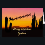 Godson Christmas Santa Over Wüste<br><div class="desc">Eine Weihnachtskarte für Ihren Sohn,  die dem Weihnachtsmann zeigt,  der über die Wüste fliegt. In der Silhouette sind viele große Kakteen zu sehen. Wünschen Sie ein frohes Weihnachtsfest aus der Wüste mit einer schönen Sonnenuntergang farbenen Karte.</div>