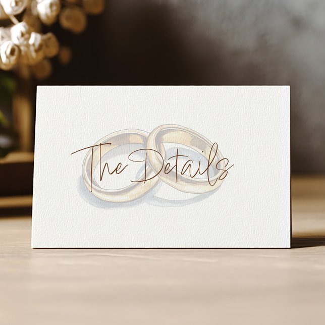 Gold Hochzeitsringe im Hintergrund Begleitkarte (Gold rings details card with elegant script on cream background)