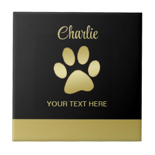 Gold Shiny Dog Paw auf schwarzem Hintergrund Fliese